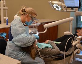 Dental Hygienist working on a patient